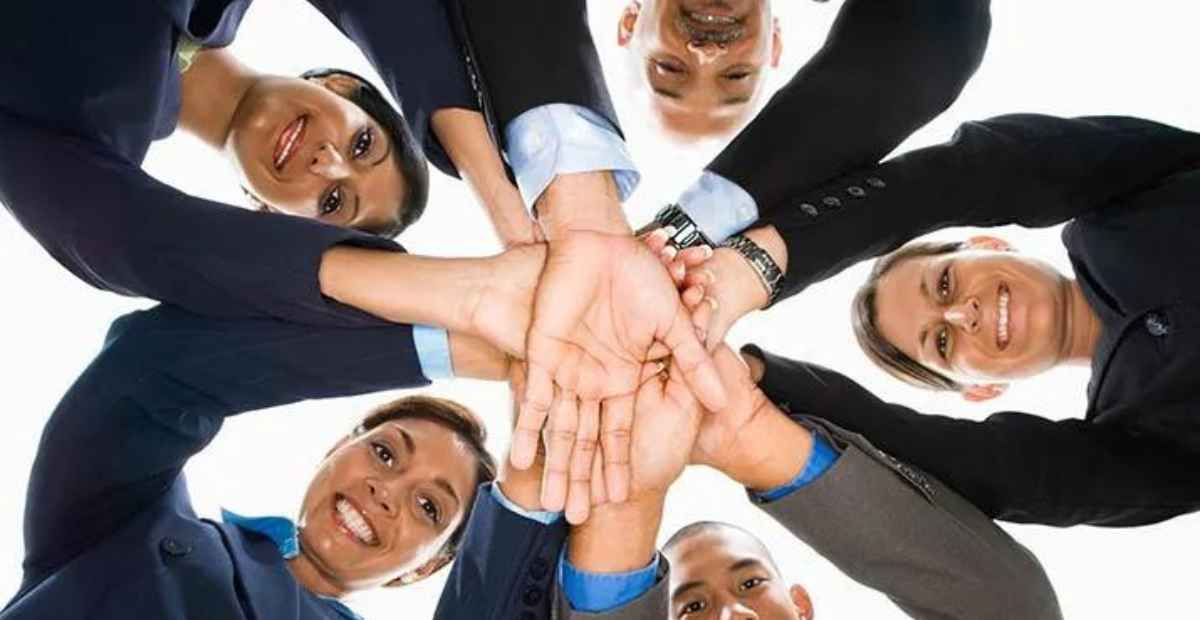 Encourage teamwork | team of female employees emphasizing on teamwork