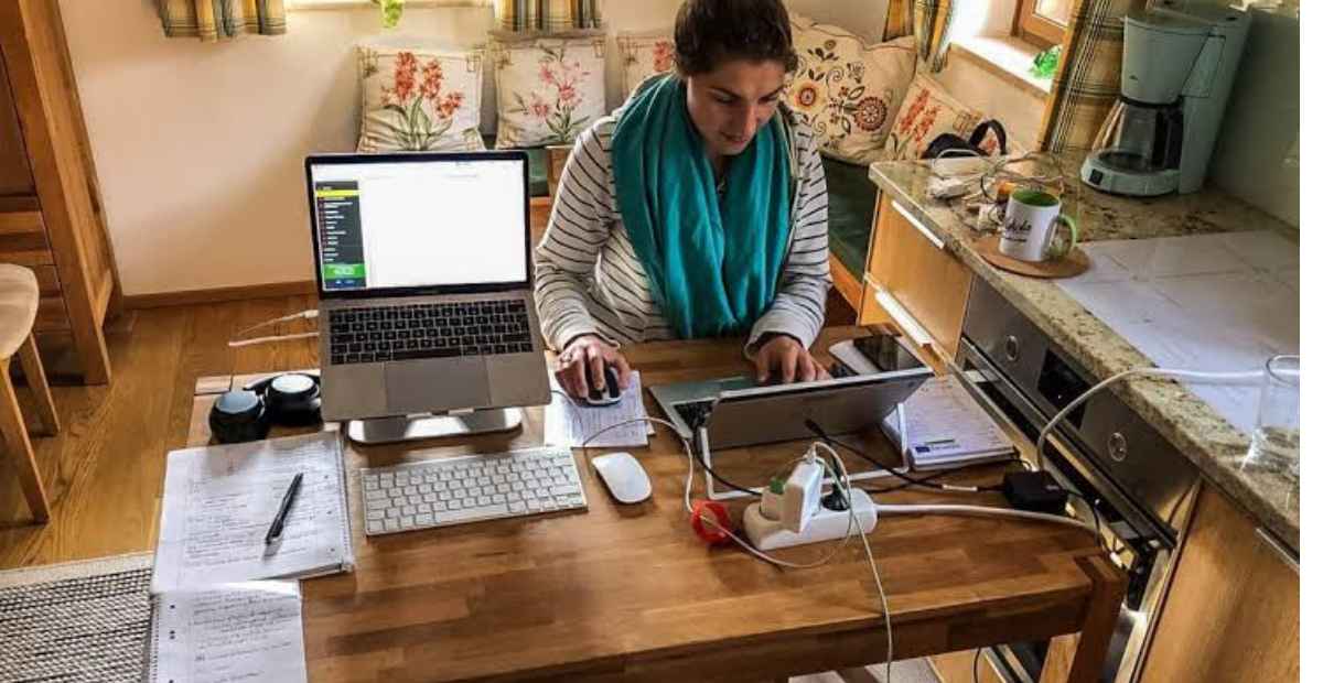 Provide flexible work arrangements | A woman working from home. 