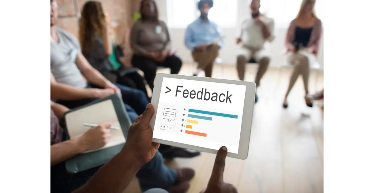 Welcome team feedback | team giving feedback via tablet